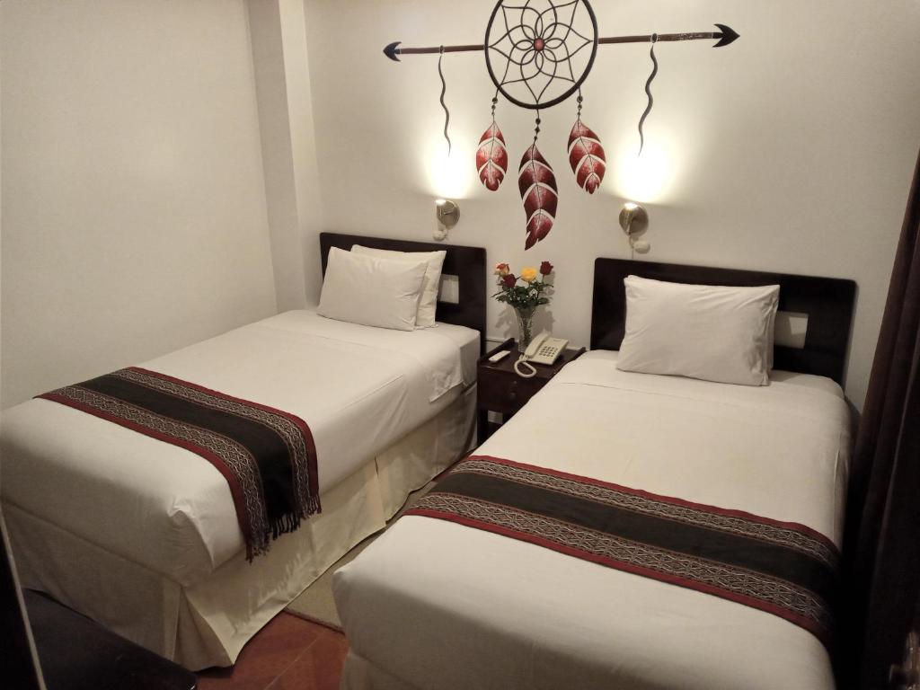 Ein Bett oder Betten in einem Zimmer der Unterkunft Inkas Land