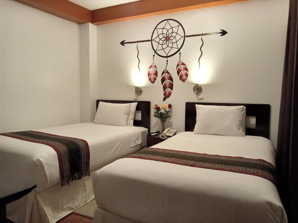 Ein Bett oder Betten in einem Zimmer der Unterkunft Inkas Land
