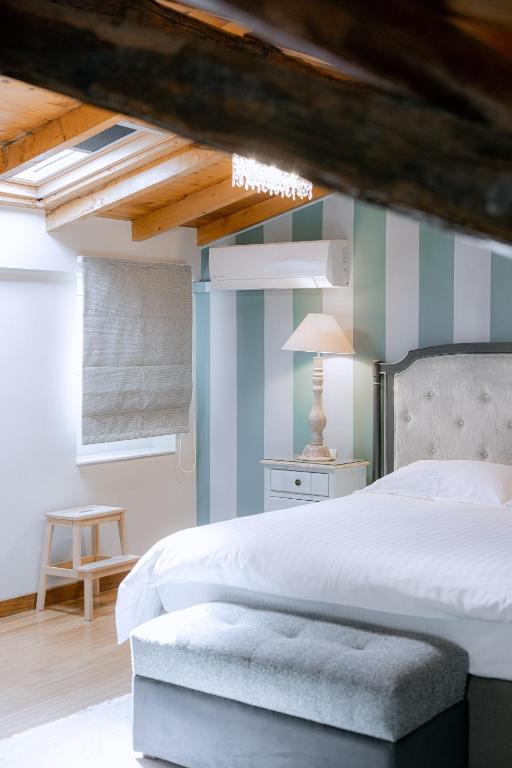 Postel nebo postele na pokoji v ubytování Kastello Hotel
