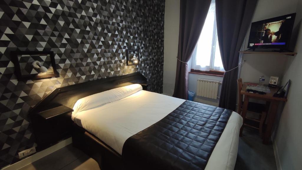 Postel nebo postele na pokoji v ubytování Hotel Angleterre