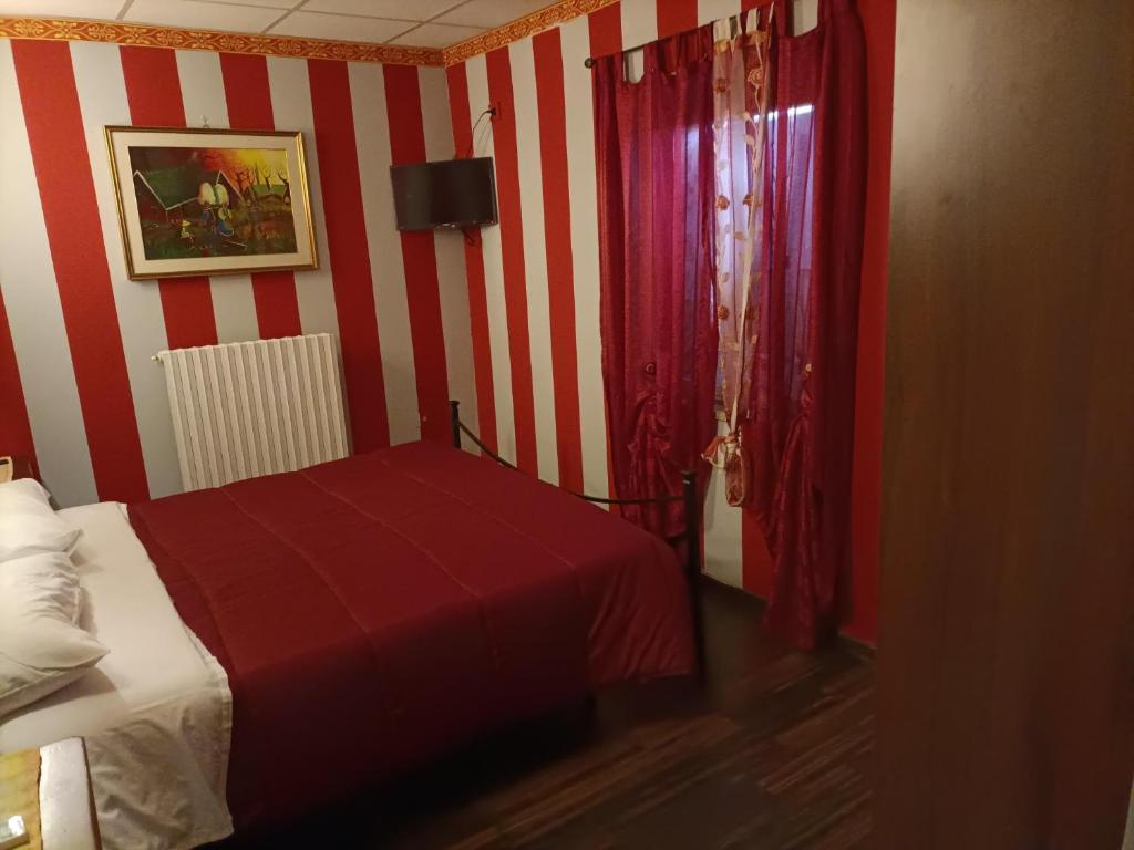 Postel nebo postele na pokoji v ubytování Locanda del Principe