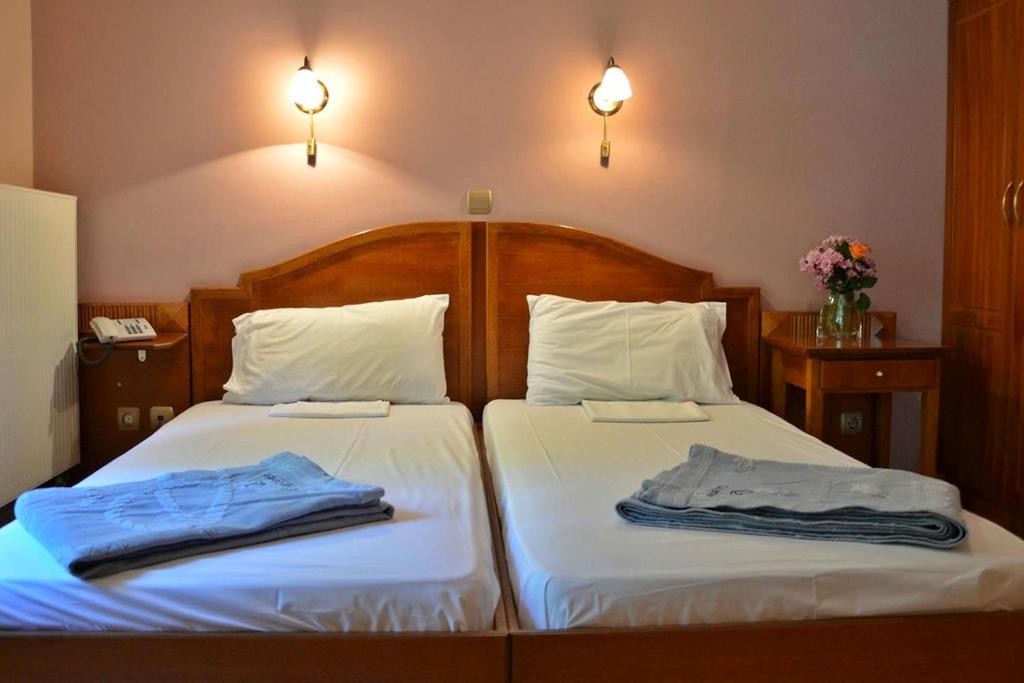 Postel nebo postele na pokoji v ubytování Archontiko tou Ziaka