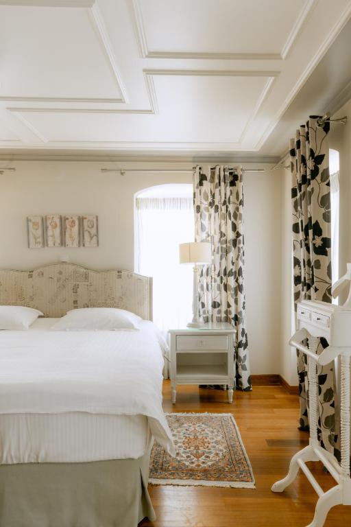 Postel nebo postele na pokoji v ubytování Kastello Hotel