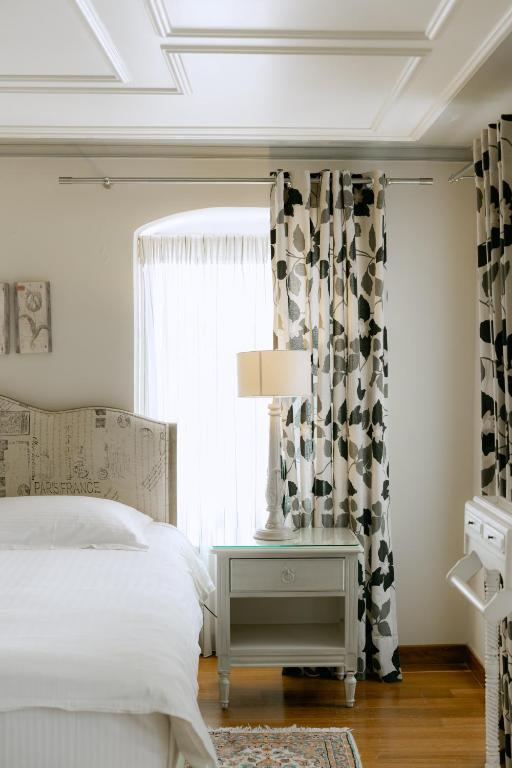 Postel nebo postele na pokoji v ubytování Kastello Hotel