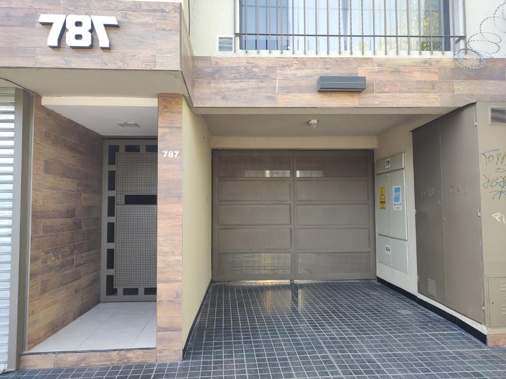 a building with a garage door with a number on it at 787 Suites in La Cieneguita