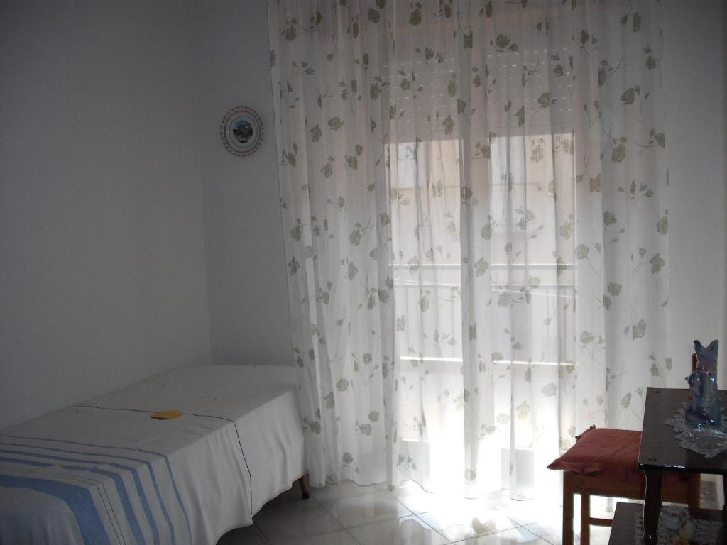 سرير أو أسرّة في غرفة في Calatafimi Segesta Apartment