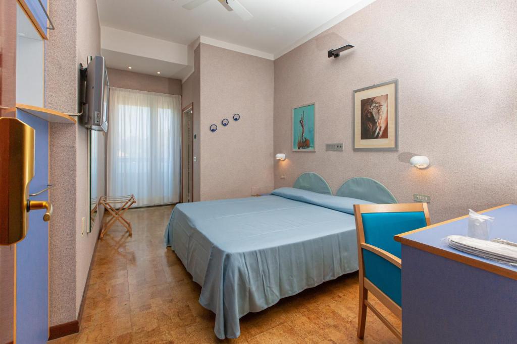 Postel nebo postele na pokoji v ubytování Hotel Venere