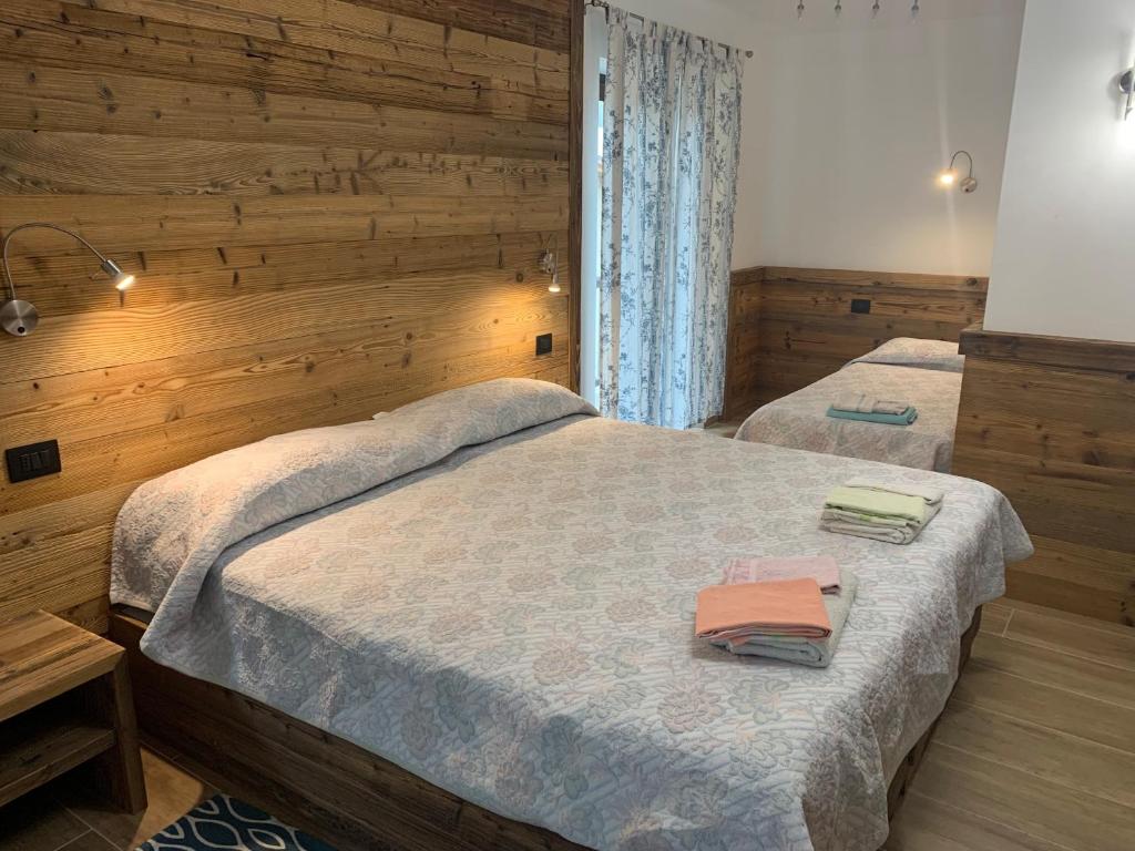 Postel nebo postele na pokoji v ubytování Hotel Beau Sejour