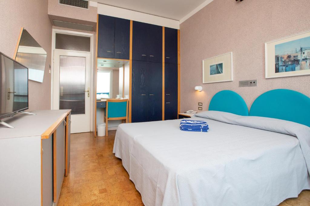 Postel nebo postele na pokoji v ubytování Hotel Venere