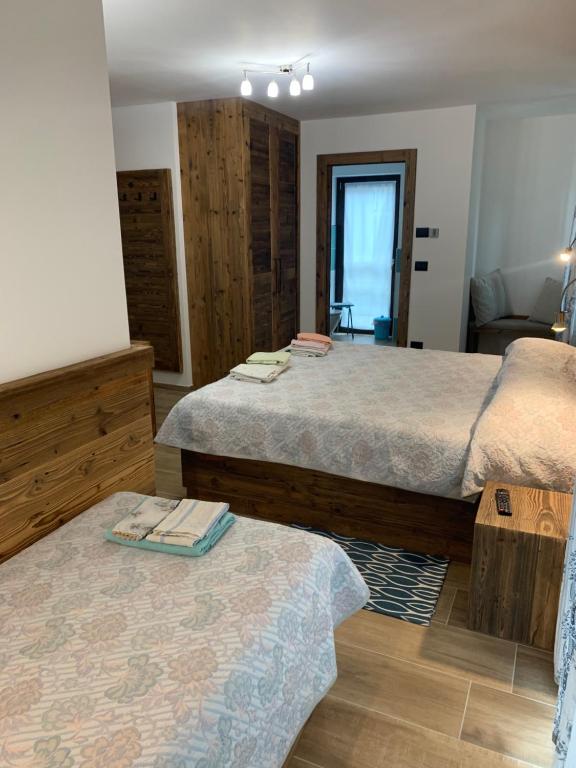 Postel nebo postele na pokoji v ubytování Hotel Beau Sejour