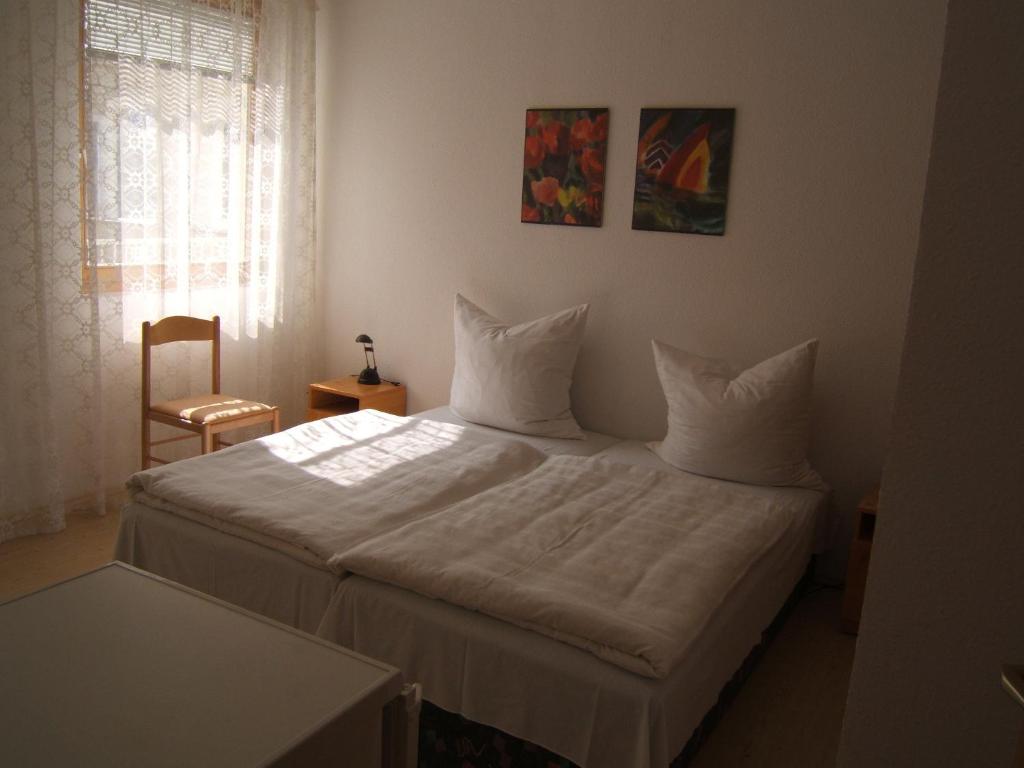 Postel nebo postele na pokoji v ubytování Jankó Apartman