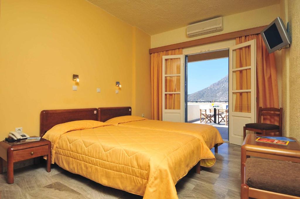 Кровать или кровати в номере Hotel Philoxenia