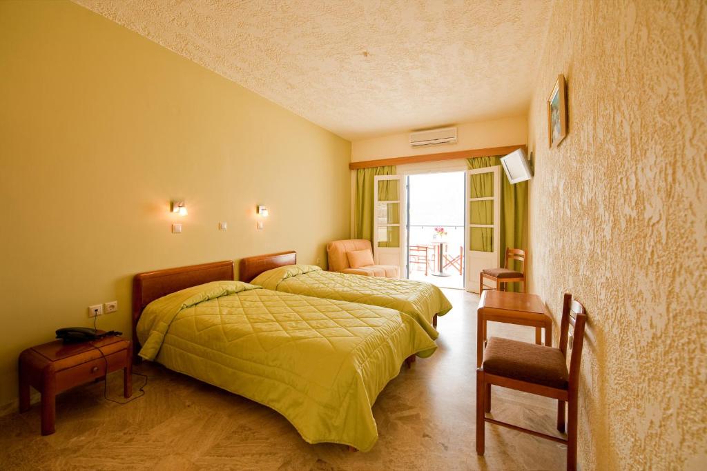 Кровать или кровати в номере Hotel Philoxenia