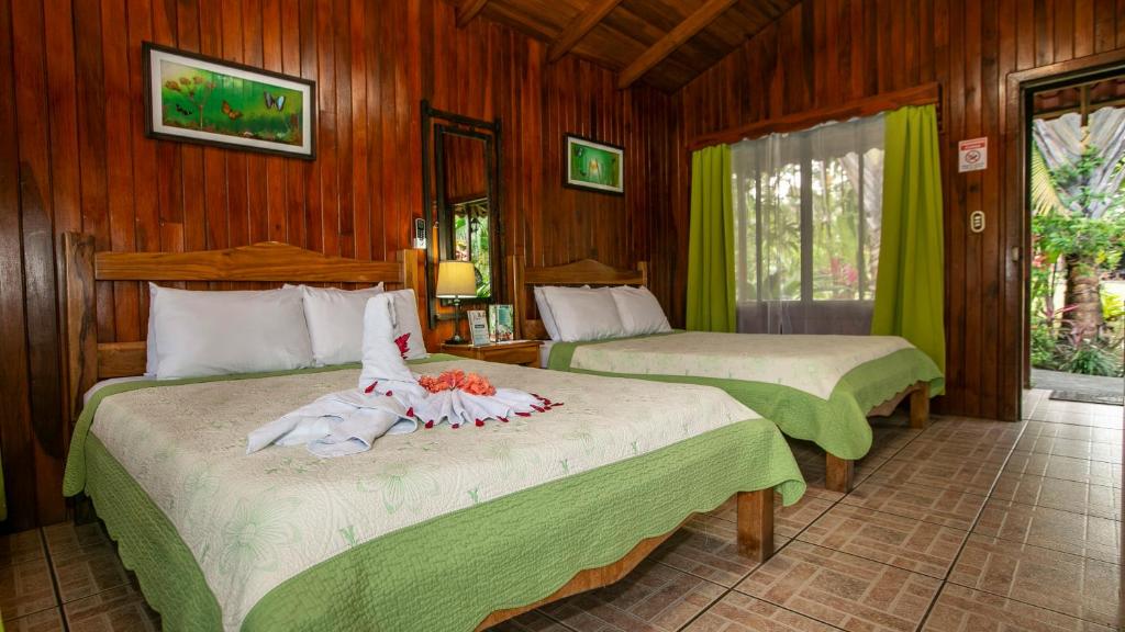 Postel nebo postele na pokoji v ubytování Hotel Rancho Cerro Azul