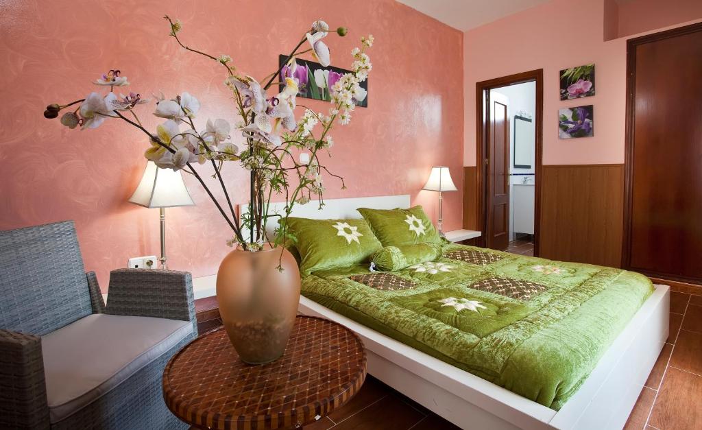 Postel nebo postele na pokoji v ubytování Hotel Atalaya