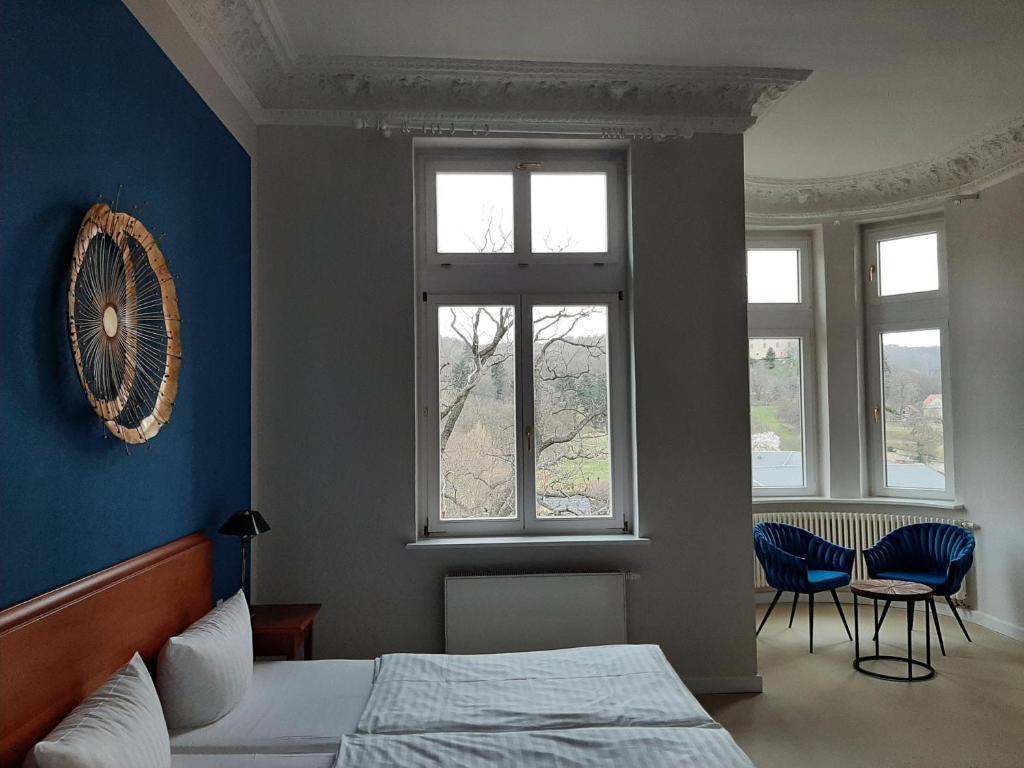 Postel nebo postele na pokoji v ubytování Hotel Villa Viktoria Luise