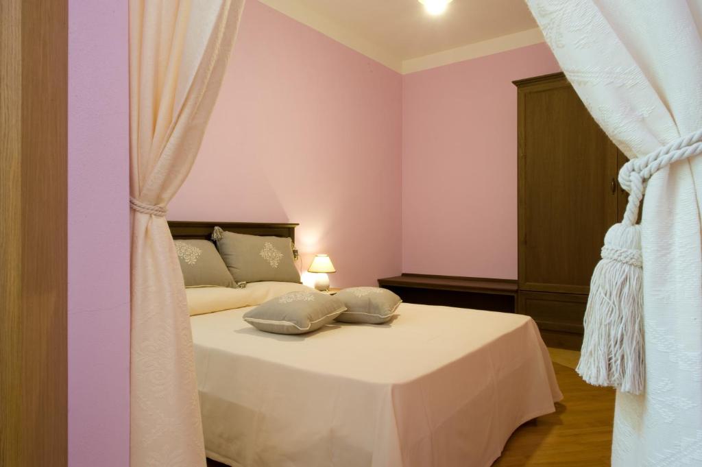 Ein Bett oder Betten in einem Zimmer der Unterkunft Piazza Azuni 18 Guest House
