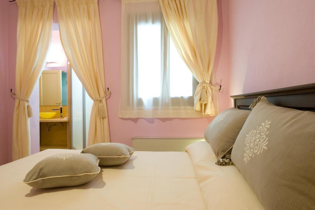 Ein Bett oder Betten in einem Zimmer der Unterkunft Piazza Azuni 18 Guest House