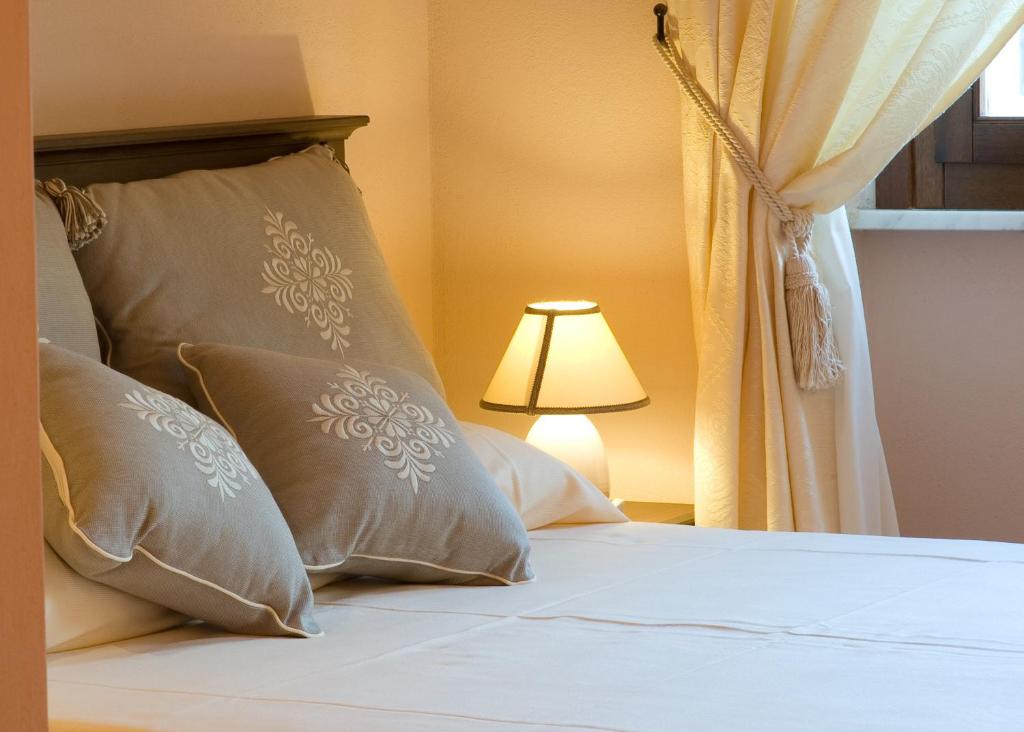 Ein Bett oder Betten in einem Zimmer der Unterkunft Piazza Azuni 18 Guest House