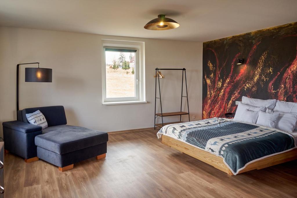 Postel nebo postele na pokoji v ubytování Urtica apartmány