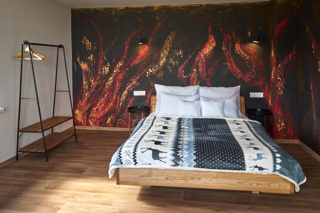 Postel nebo postele na pokoji v ubytování Urtica apartmány