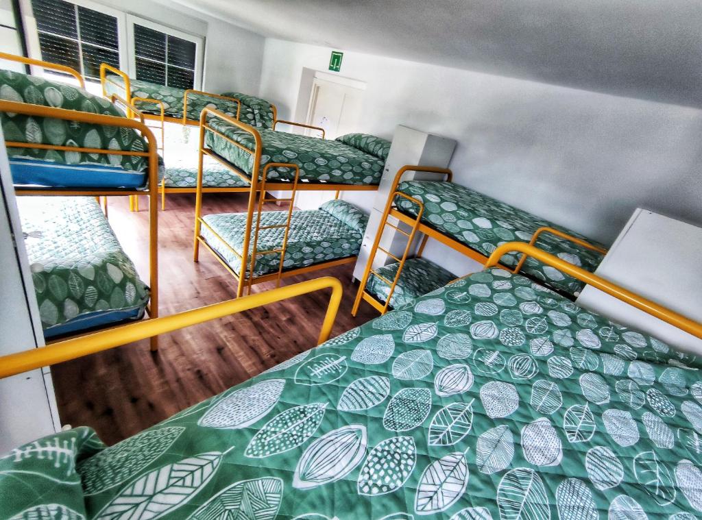 a group of bunk beds in a room at Albergue de Santullán in Castro-Urdiales
