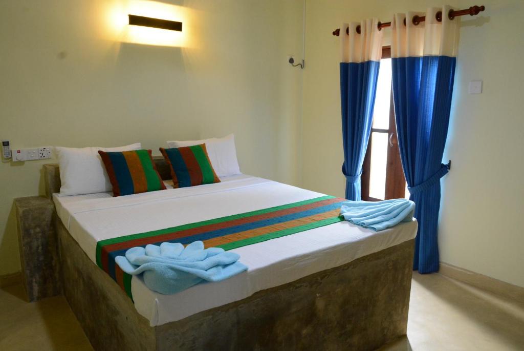 Postel nebo postele na pokoji v ubytování Hotel Thilon