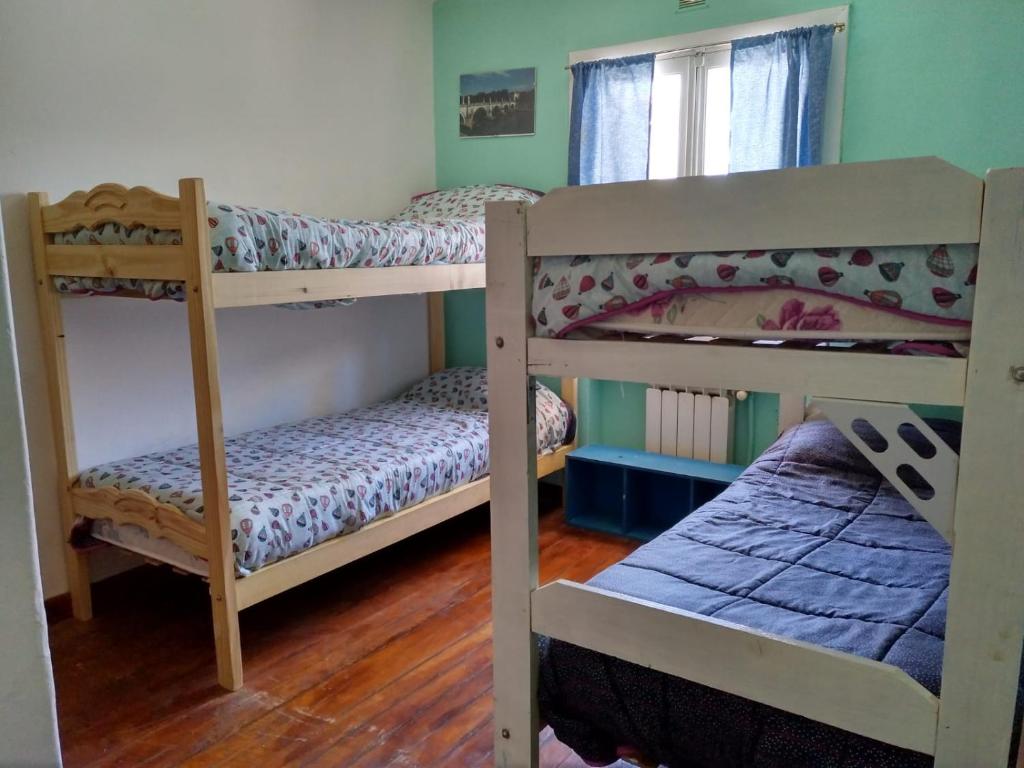 Postel nebo postele na pokoji v ubytování HOPA-Home Patagonia Hostel & Bar