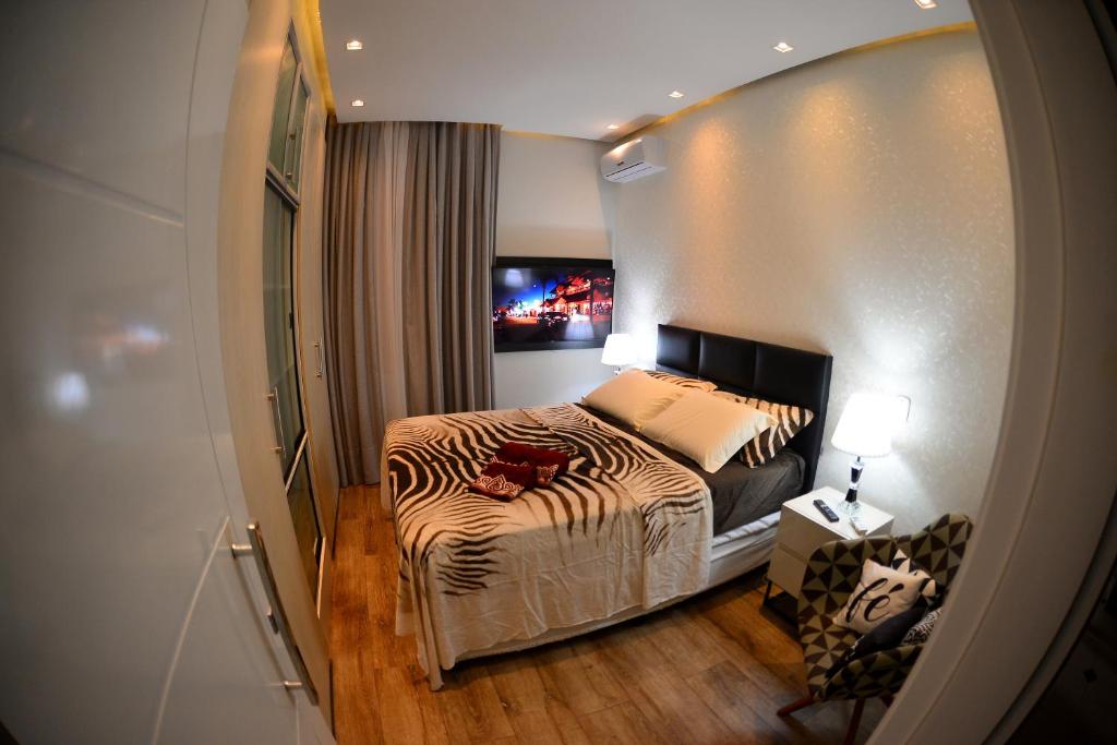 Postel nebo postele na pokoji v ubytování Apartamento Quarto e sala luxo COPACABANA O MUST'
