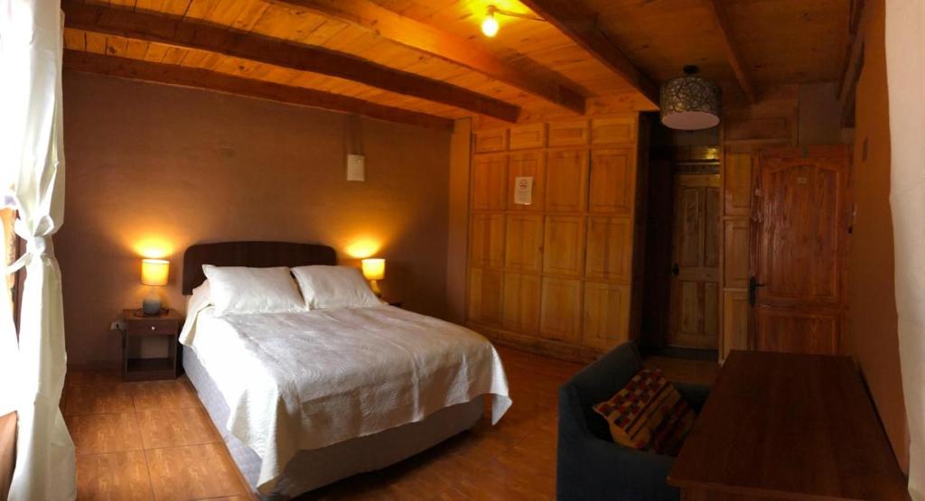 Postel nebo postele na pokoji v ubytování Sami Atacama