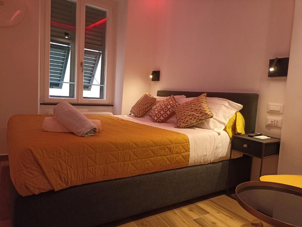 Кровать или кровати в номере Al Porto 61 - Rooms for Rent