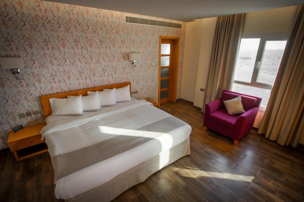 Postel nebo postele na pokoji v ubytování Sama Muscat Hotel