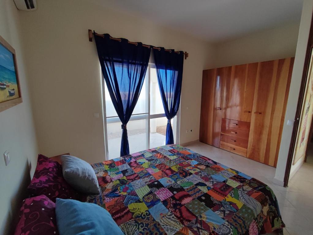 Postel nebo postele na pokoji v ubytování Casa Djarmai Boutique Apartments