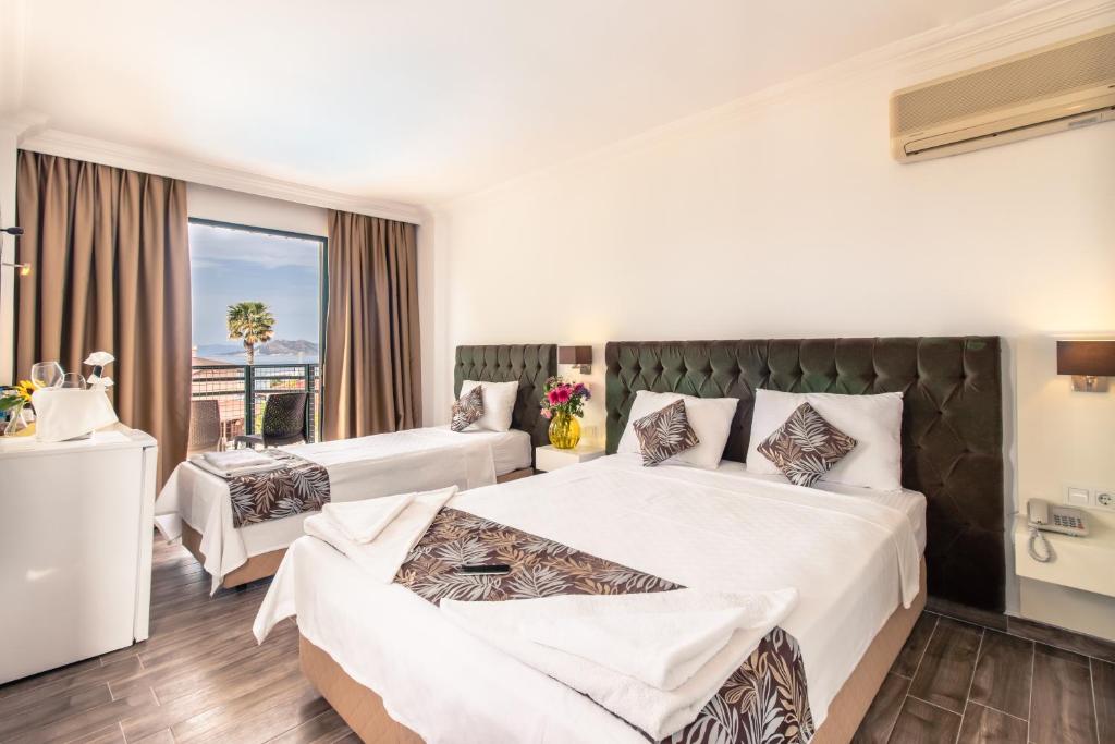Postel nebo postele na pokoji v ubytování Bahar Hotels