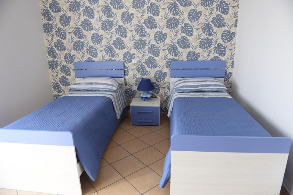 Łóżko lub łóżka w pokoju w obiekcie Fornillo 41
