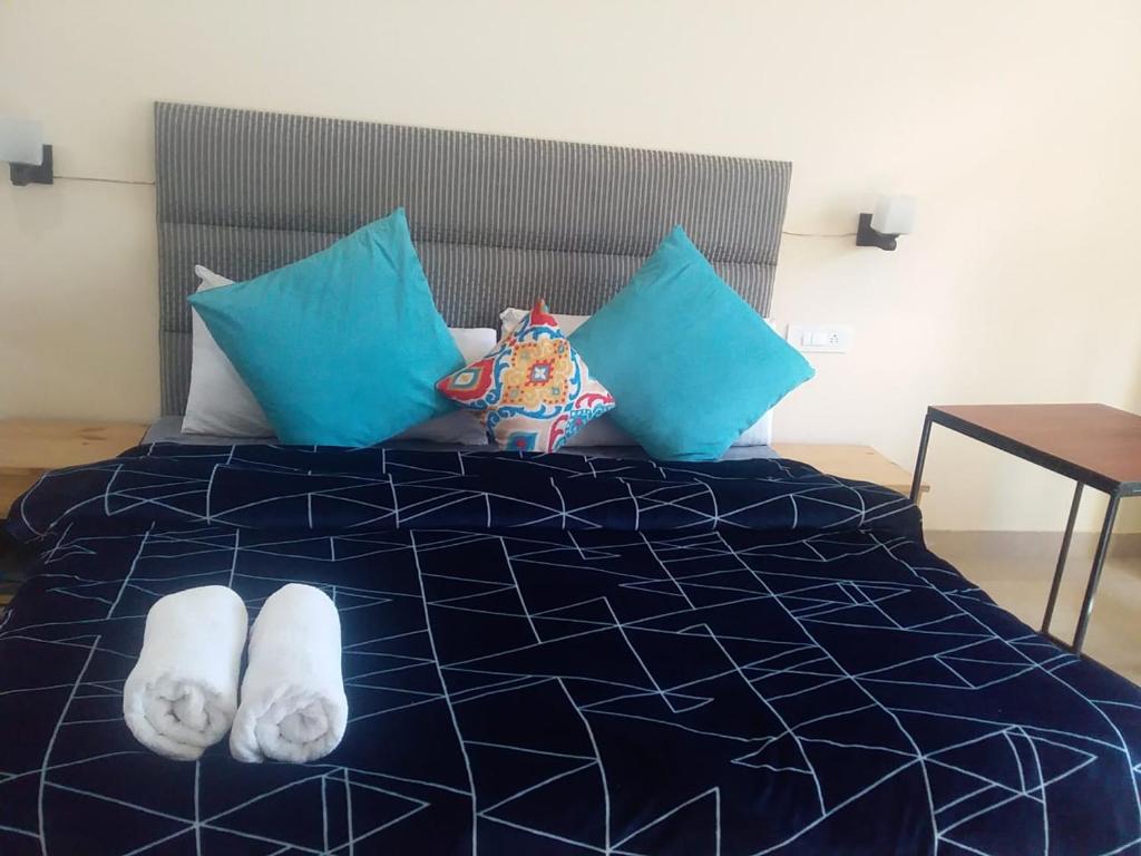 Postel nebo postele na pokoji v ubytování Getaway Stays Manali