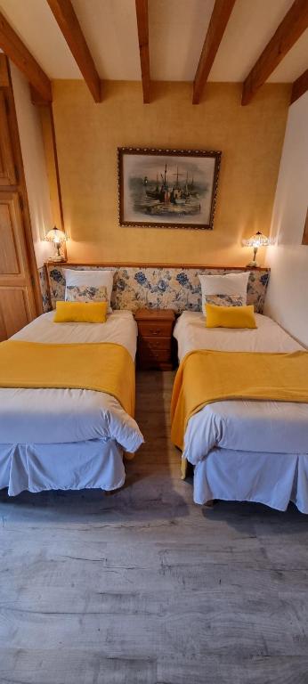 Postel nebo postele na pokoji v ubytování Le Relais de la Comté
