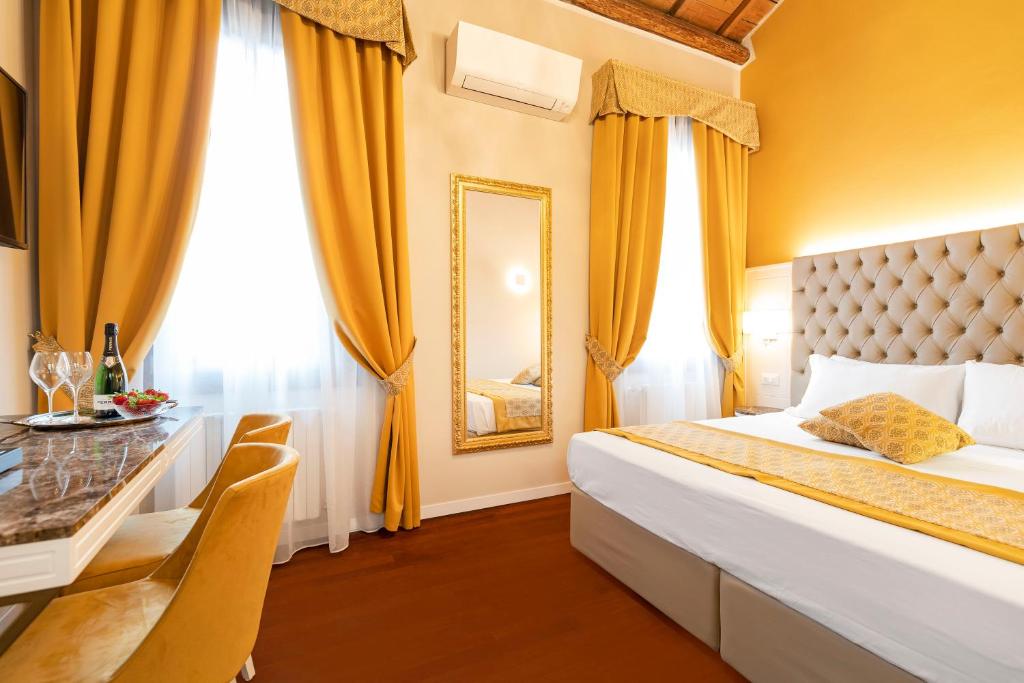 Posteľ alebo postele v izbe v ubytovaní Residenza La Duchessa Deluxe Rooms