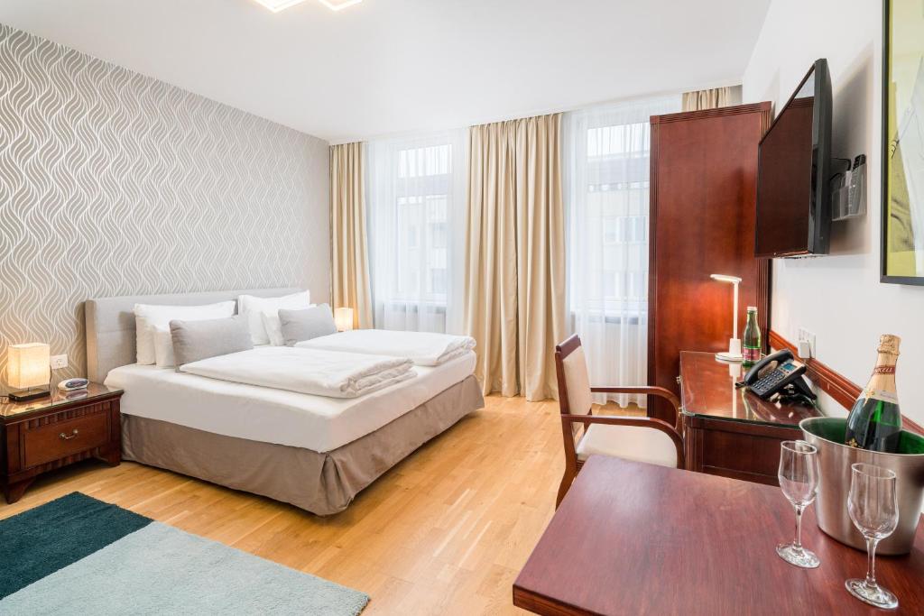 Posteľ alebo postele v izbe v ubytovaní Best Western Plus Celebrity Suites