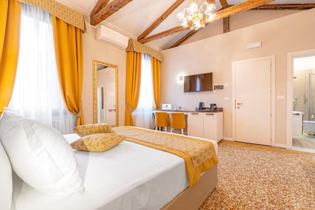 Posteľ alebo postele v izbe v ubytovaní Residenza La Duchessa Deluxe Rooms