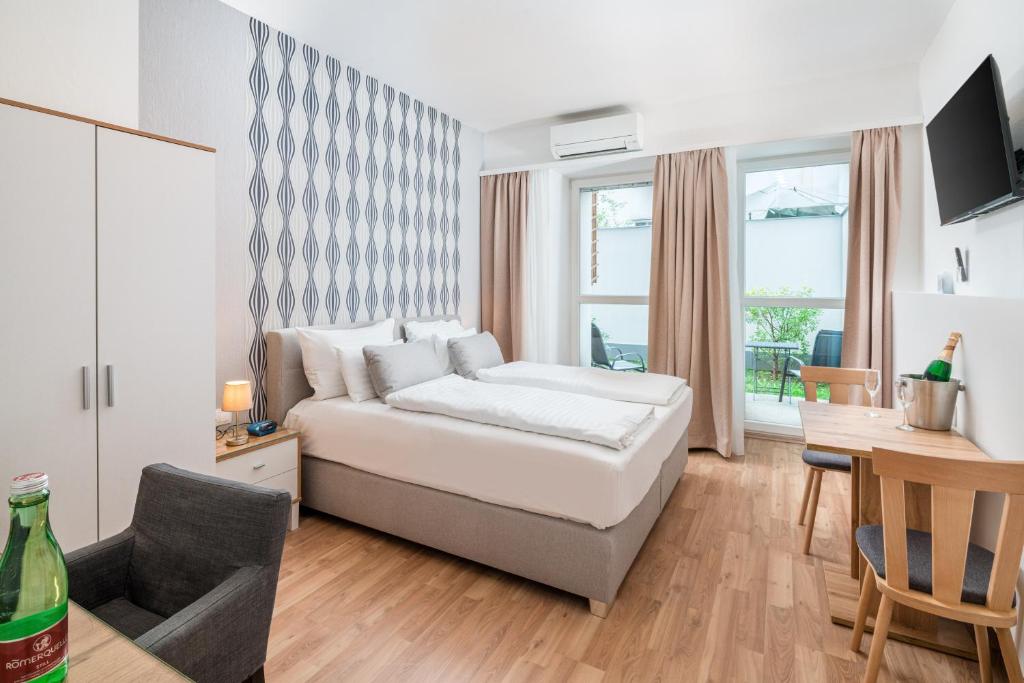 Posteľ alebo postele v izbe v ubytovaní Best Western Plus Celebrity Suites