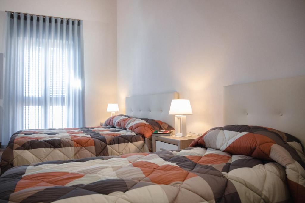 Postel nebo postele na pokoji v ubytování Le Vie di Girgenti