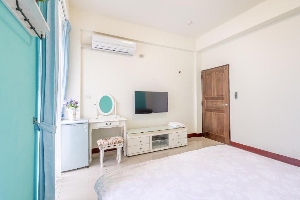 TV a/nebo společenská místnost v ubytování Happy Stay Inn