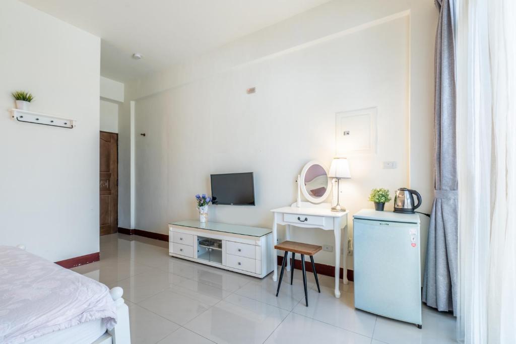 TV a/nebo společenská místnost v ubytování Happy Stay Inn