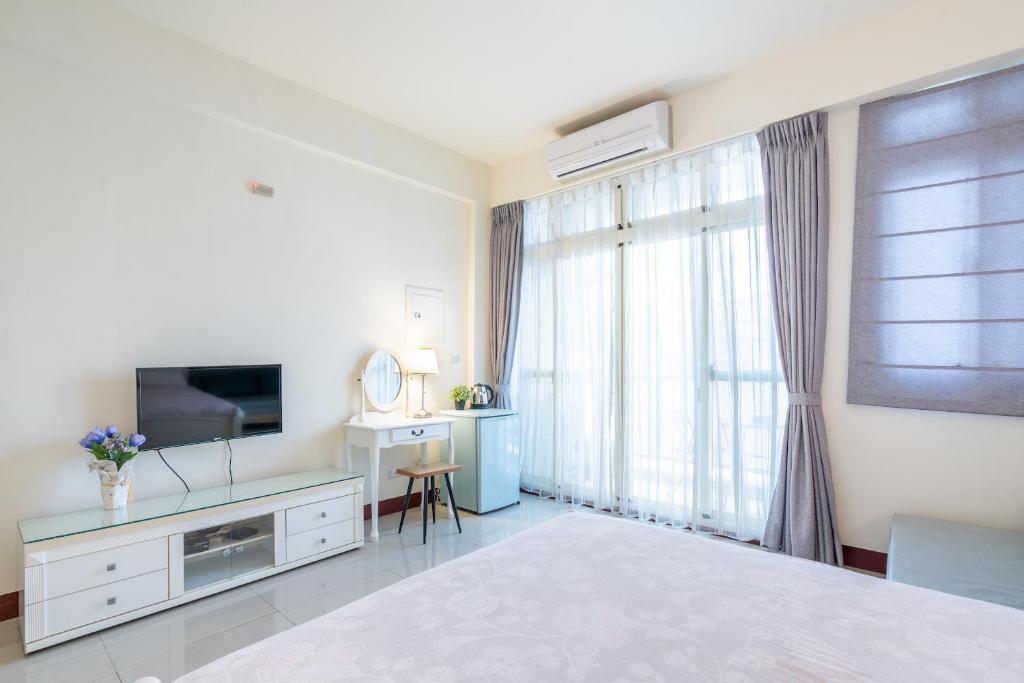 TV a/nebo společenská místnost v ubytování Happy Stay Inn