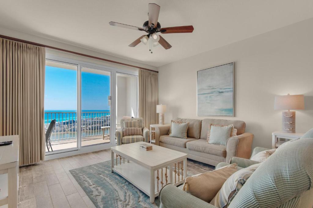a living room with a view of the ocean at Ariel Dunes II 1807- High Tide in Destin
