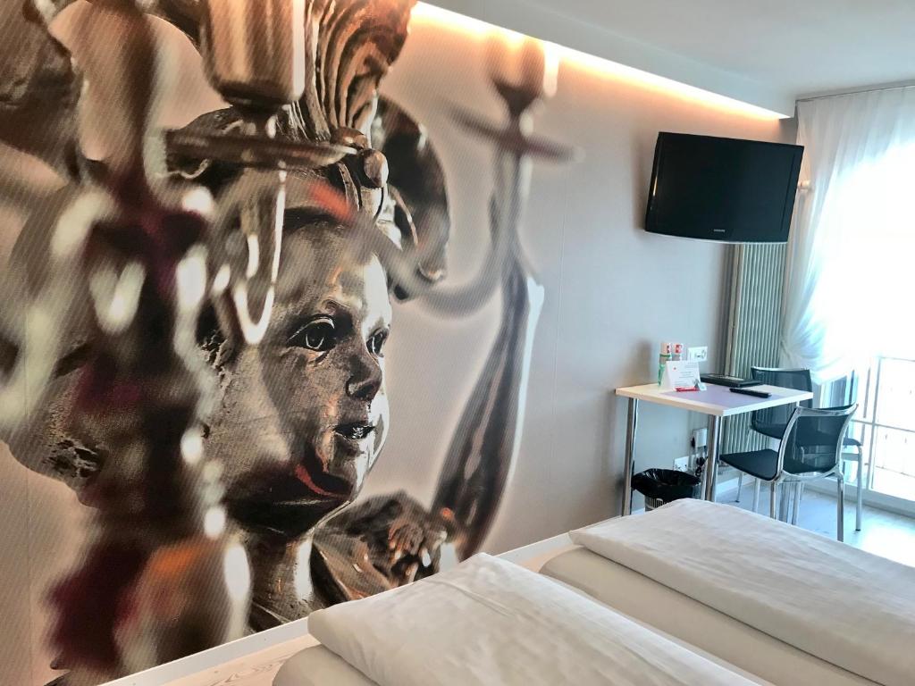 Postel nebo postele na pokoji v ubytování Hotel Murtenhof & Krone