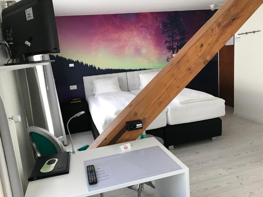 Postel nebo postele na pokoji v ubytování Hotel Murtenhof & Krone