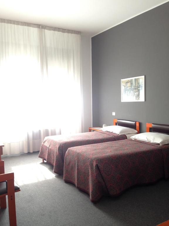 Postel nebo postele na pokoji v ubytování Hotel Al Cason