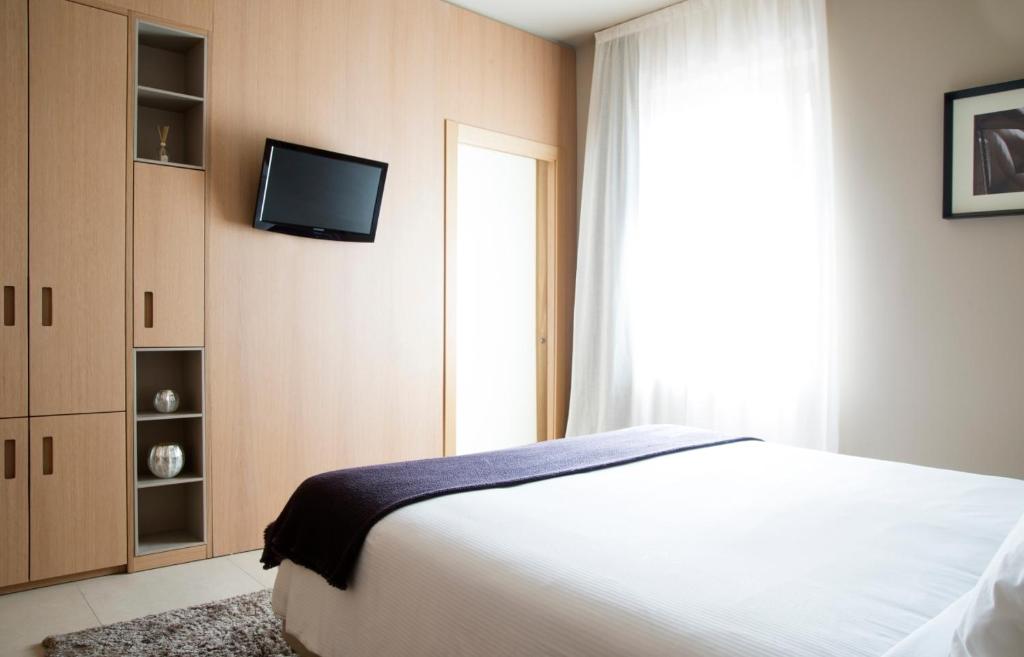 Postel nebo postele na pokoji v ubytování Albergo Nicolin